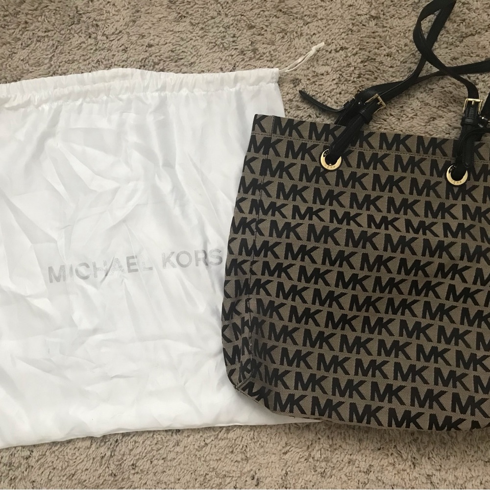 Michael Kors Large Monogramed tote.  Brown and Black logo and gold accents.